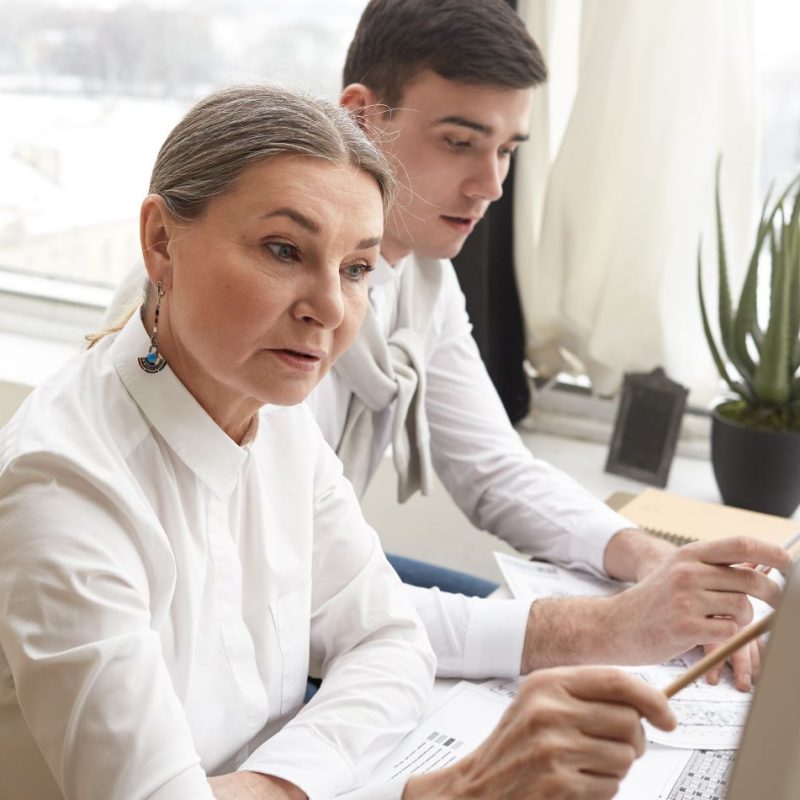 confident-skilled-mature-woman-engineer-making-sketches-using-computer-engineering-equipment-working-construction-plan-together-with-her-ambitious-young-man-colleague-talent-creativity.jpg