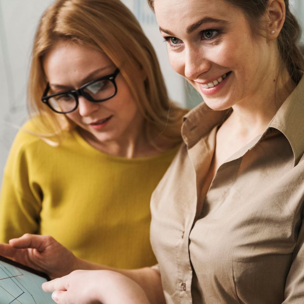 smiley-businesswomen-meeting-with-tablet.jpg